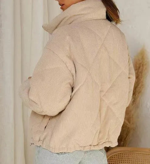 Women's apricot-coloured corduroy jacket with a stand collar, long sleeves, and a front zip.