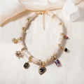 Close-up of a heart-shaped resin and bamboo pendant necklace with an electroplated finish.