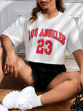 Black loose fit cotton t-shirt with printed white English letters and a navel exposed style.