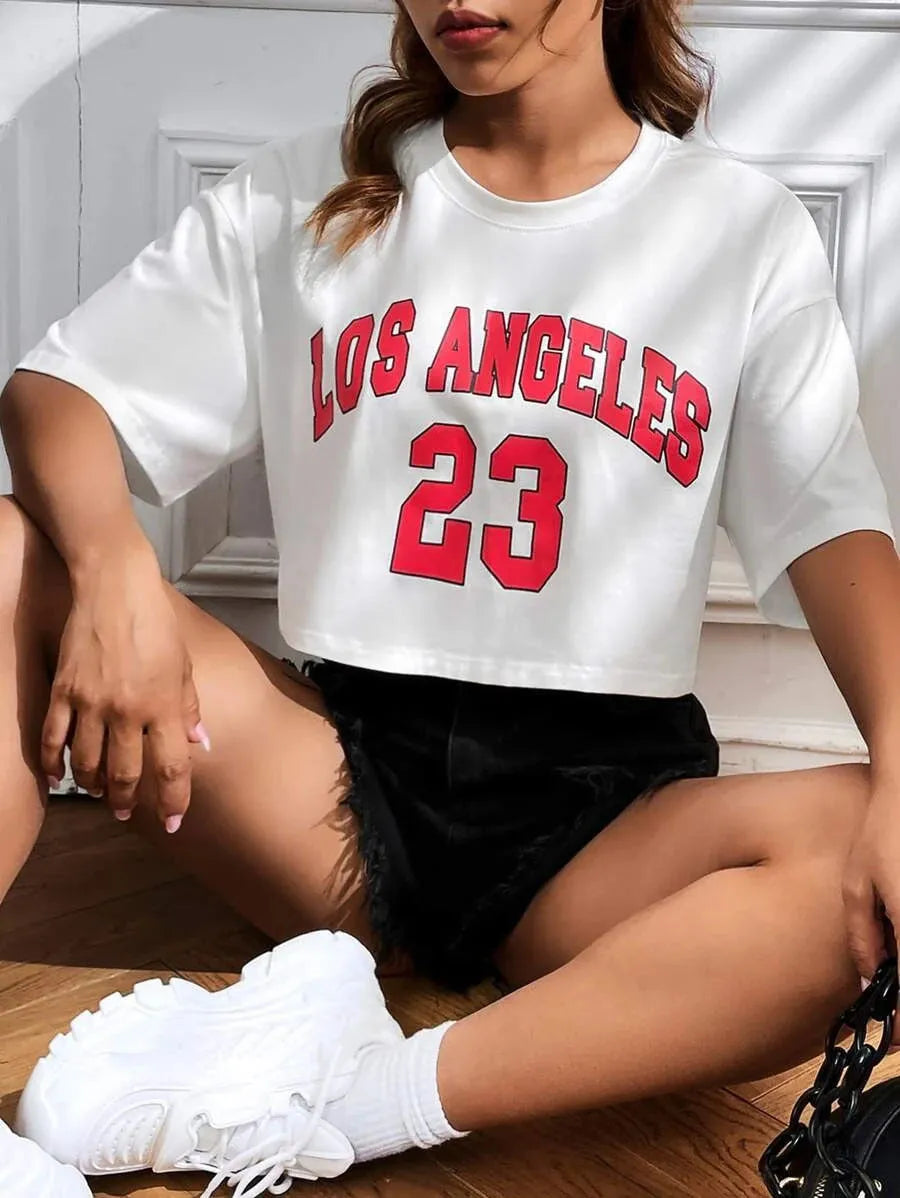 Black loose fit cotton t-shirt with printed white English letters and a navel exposed style.