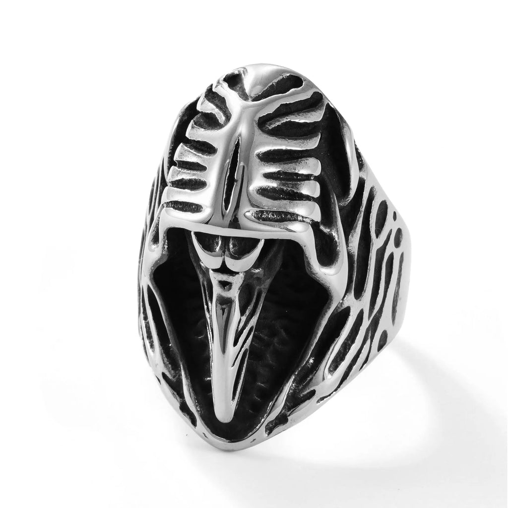Crow design geometric stainless steel punk ring in MR166 colour on a grey background.