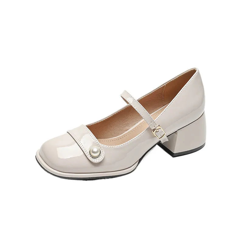 Women's apricot patent leather chunky heel pumps with a square toe and front buckle fastening.