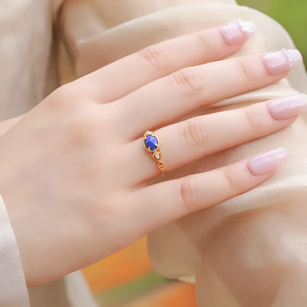 Geometric silver alloy ring with oval lapis lazuli stone in deep blue colour