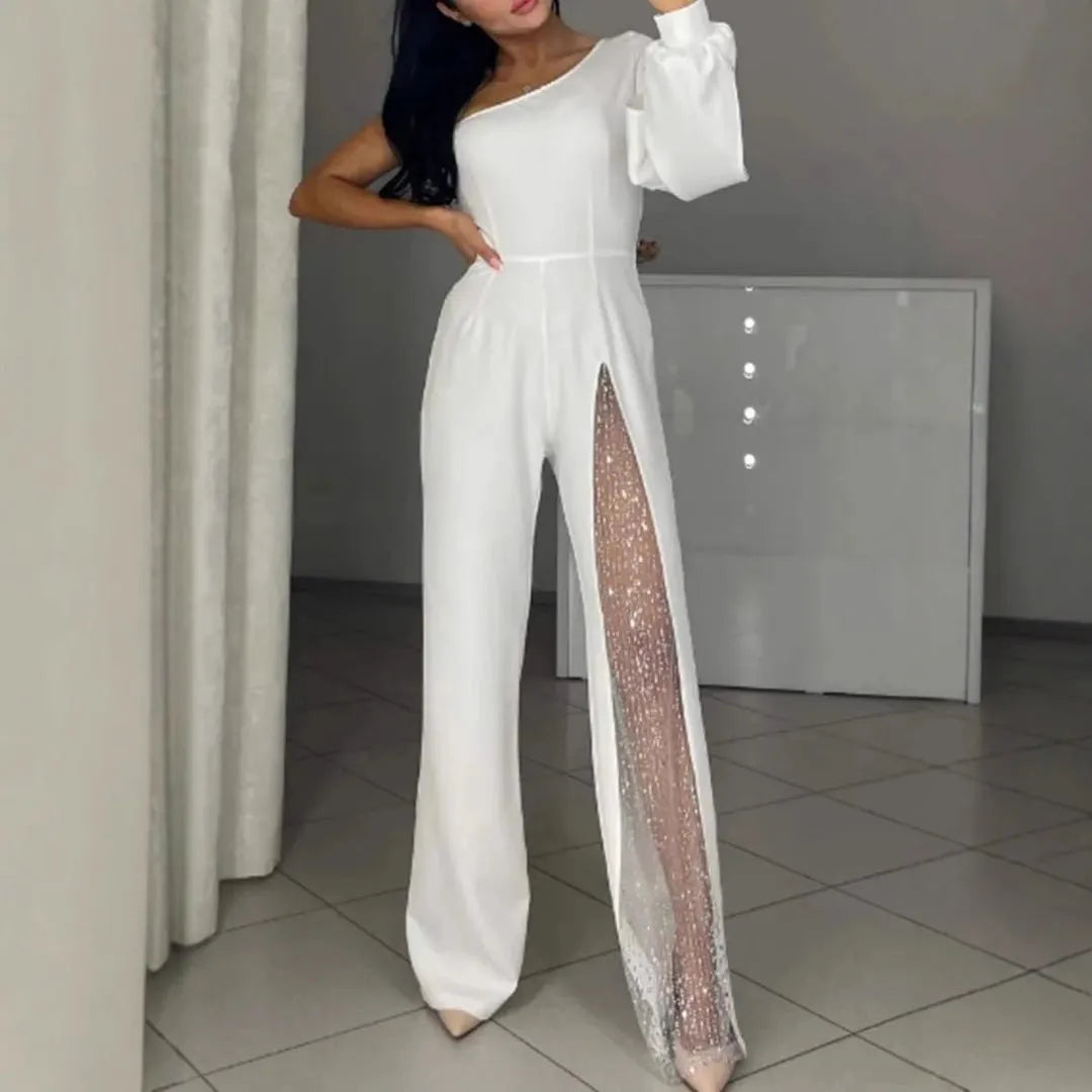 A woman wearing a black oblique shoulder jumpsuit with a high leg slit, made of polyester.