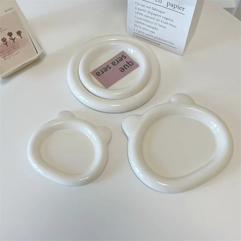 White porcelain plate with bear doodle or round doodle design, shown in 15cm and 20cm sizes.