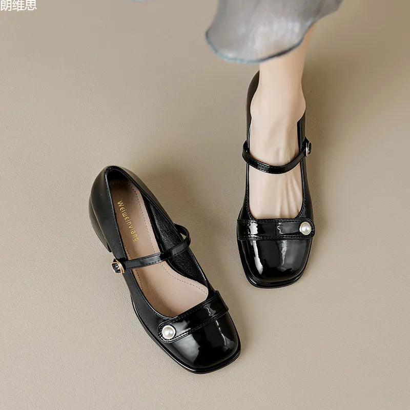 Women's apricot patent leather chunky heel pumps with a square toe and front buckle fastening.