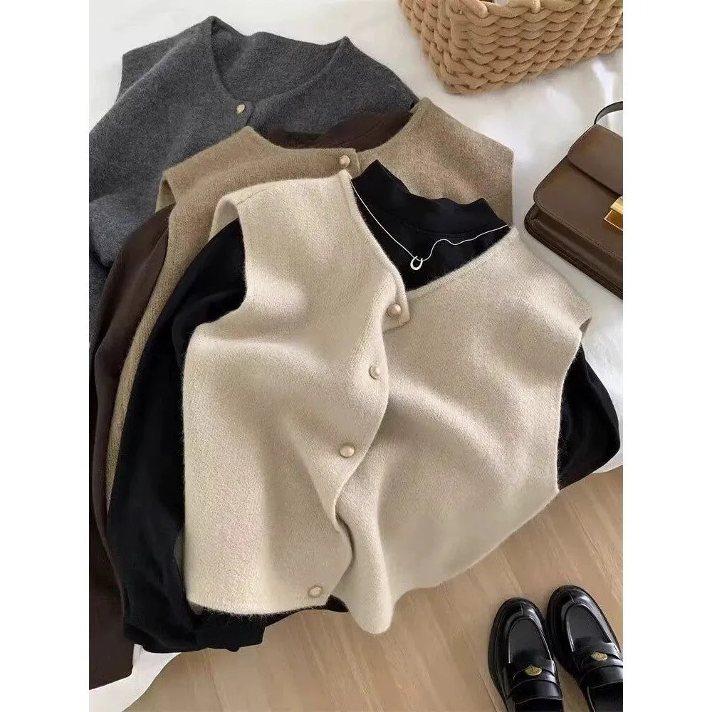 Women's grey V-neck polyester pullover vest with half-length sleeves laid flat