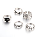 Black alloy ring with a raised retro spade card symbol and an adjustable band.