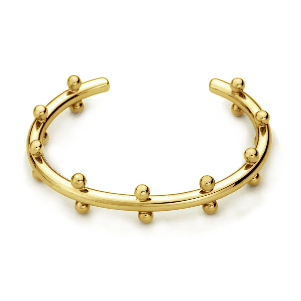 Stainless steel C-shaped bean bead with textured rivet detail in gold, silver, and two-tone finishes.