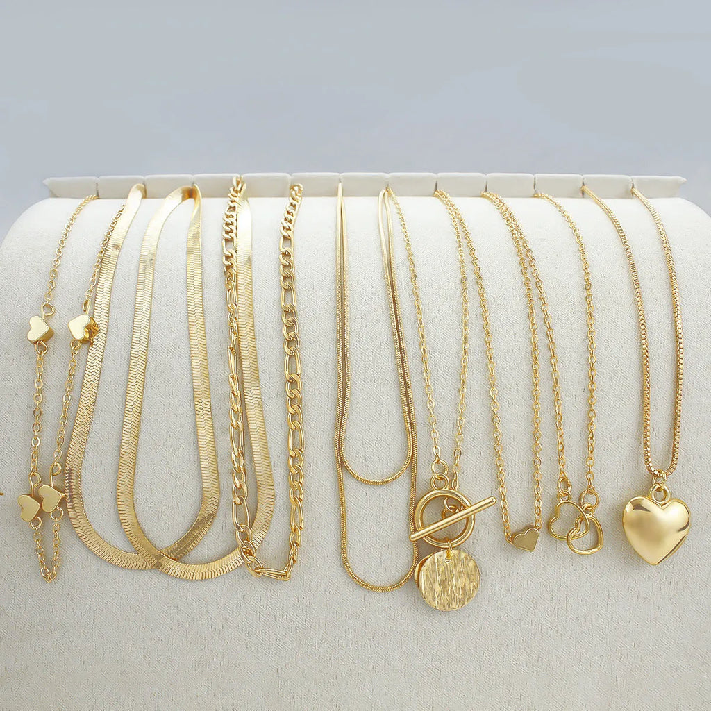 10 piece gold necklace set with snake bone chain and alloy pendants