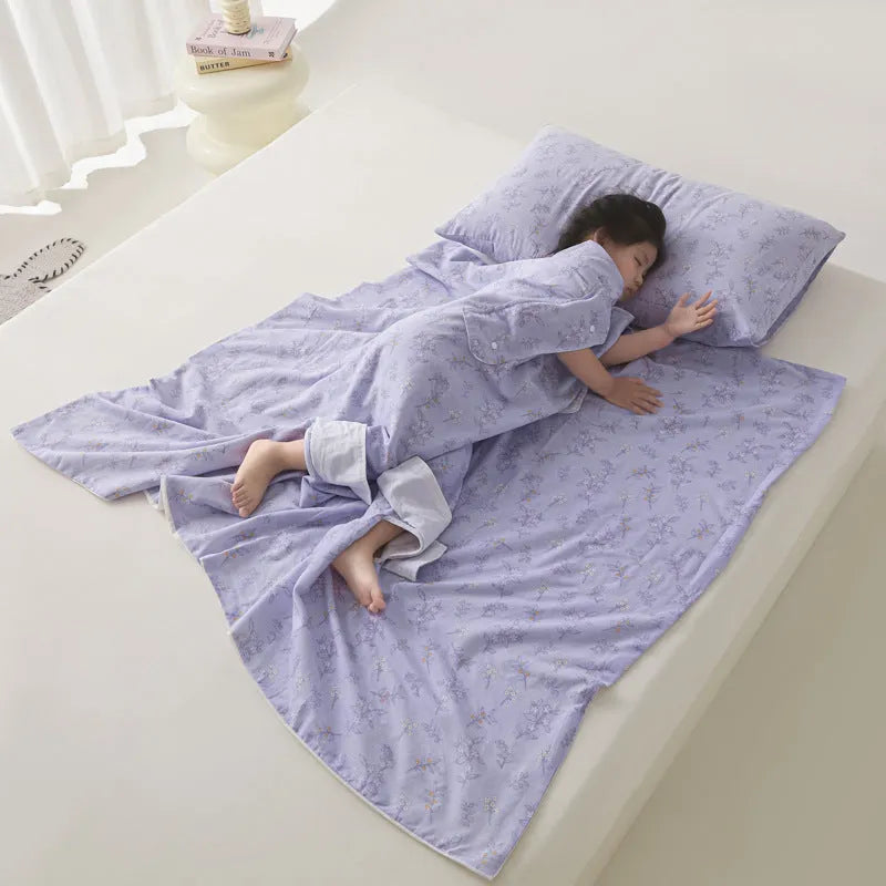 Anti-kick sleeping bag blanket in a colourful Cloud Bear Star Dream design on a bed.