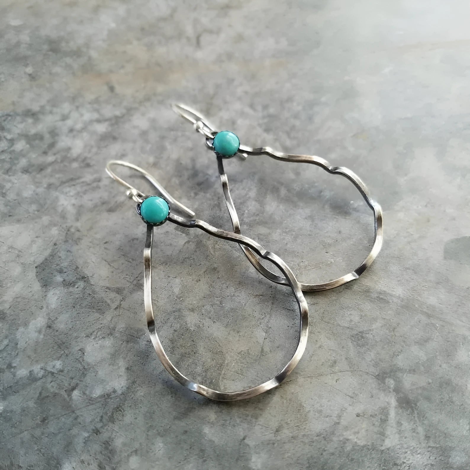 Vintage bohemian geometric circle earrings with turquoise detail in antique silver.