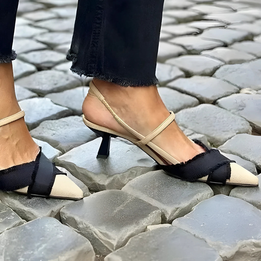 Apricot and black colour block women's stiletto sandals with a buckle strap and pointed toe.