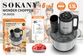 Stainless steel meat grinder and food processor machine on a kitchen countertop