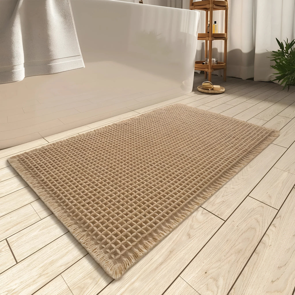 Square checkered-pattern non-slip bathroom carpet in a neutral colour on tiled floor.