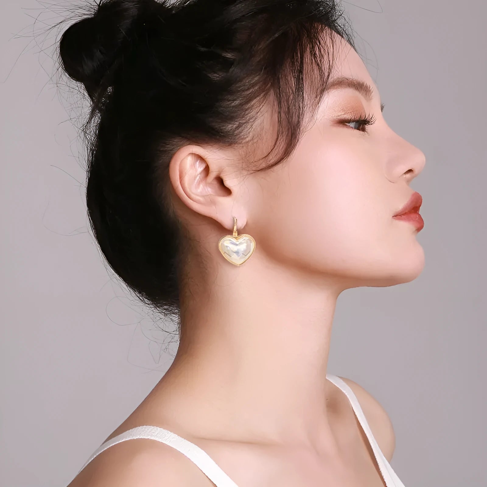 Gold tone alloy ear clips for women with clip-on design and natural styling