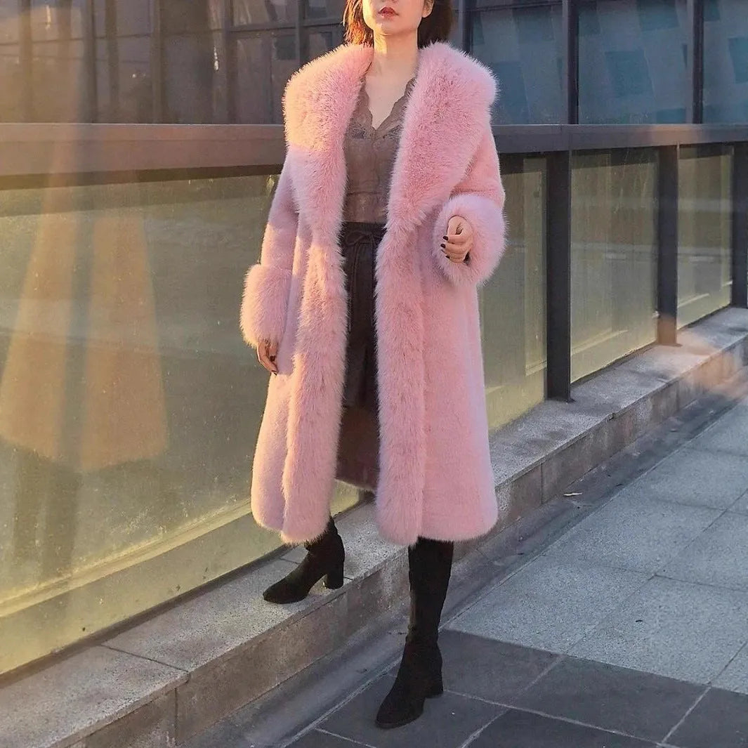 Grey women's thick faux rabbit fur mid-length coat with a fur collar on a hanger.