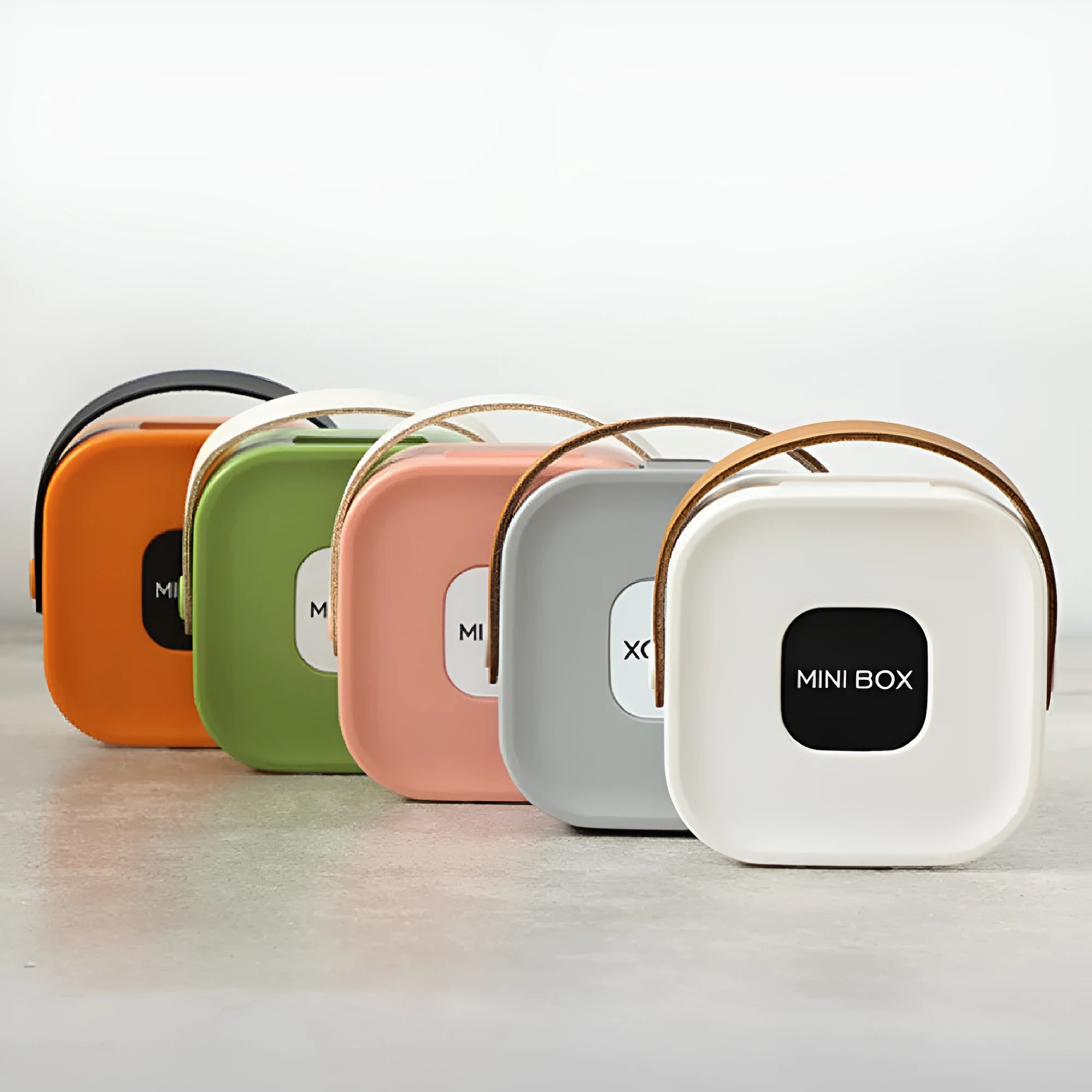 Medium polypropylene storage box with lid for organising cables and headsets, shown in Nordic White colour.