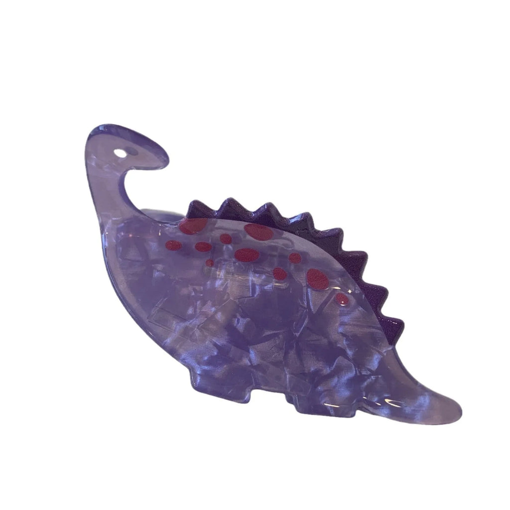 Acrylic dinosaur jaw grip hair clip showing six colour variations with prehistoric creature designs