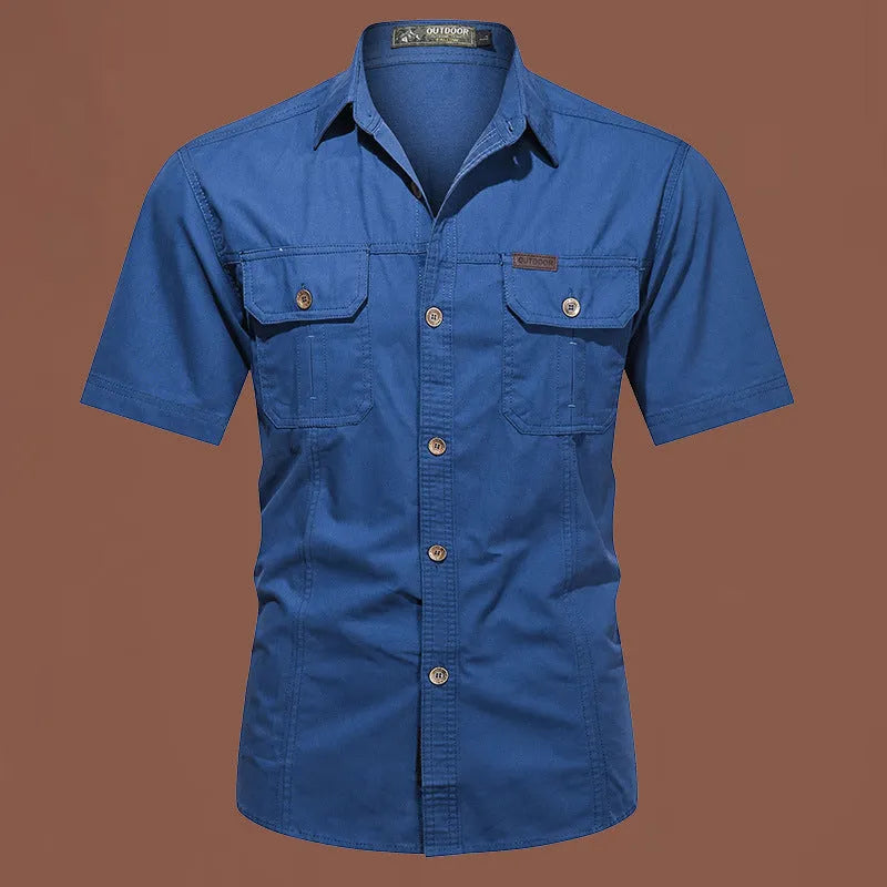 Men's army green cotton work shirt with short sleeves and a loose, non-iron fit.