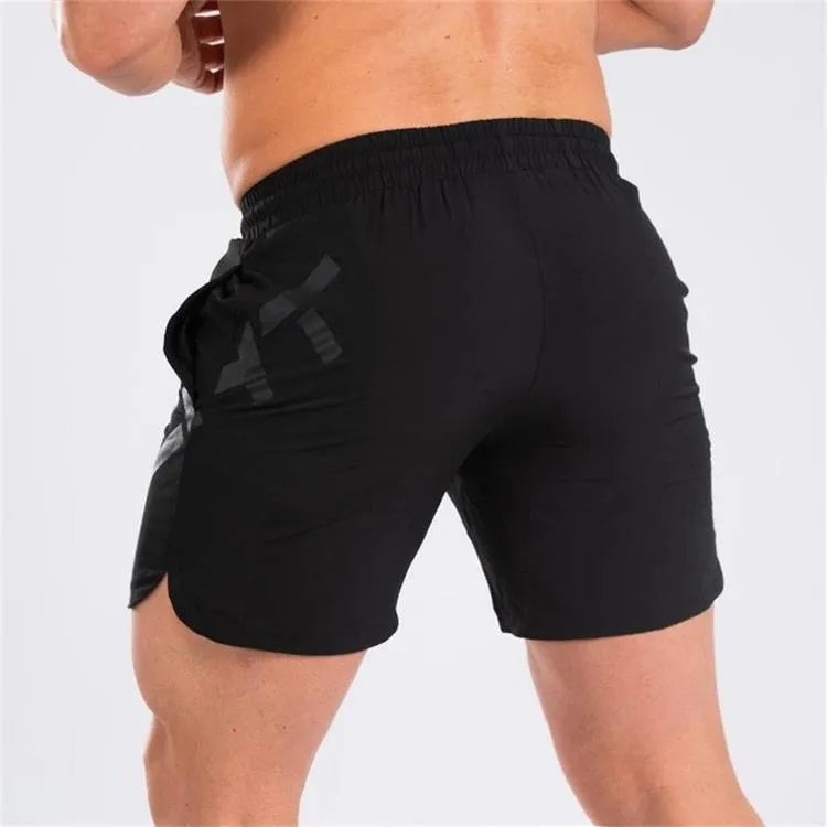 Men's black quick-dry elastic waist running shorts on a white background.