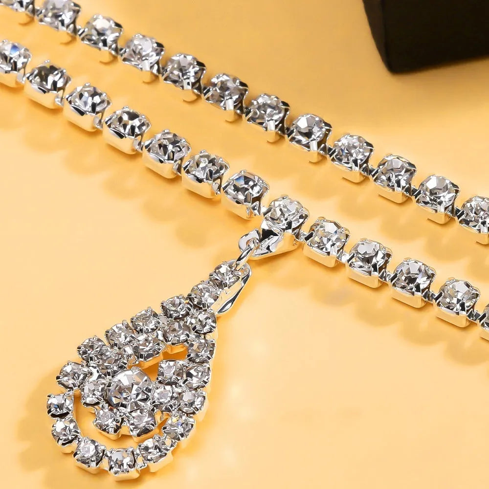 Gold or silver women's waist chain with water drop rhinestone pendant and tassel, 115cm long.