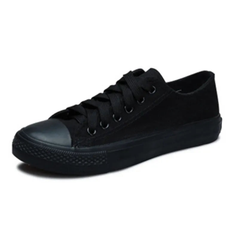 Women's solid-colour casual canvas shoes in black, white and black, white and red, or all black colourways.