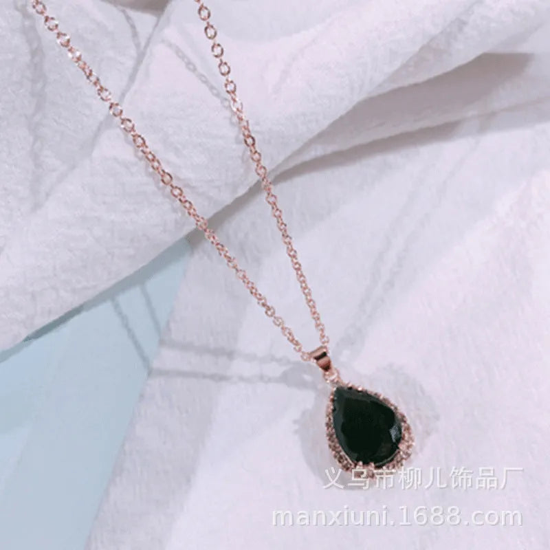 Rose gold plated drop pendant necklace with colourful rhinestones in a pink colour option.