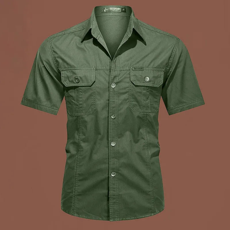 Men's army green cotton work shirt with short sleeves and a loose, non-iron fit.