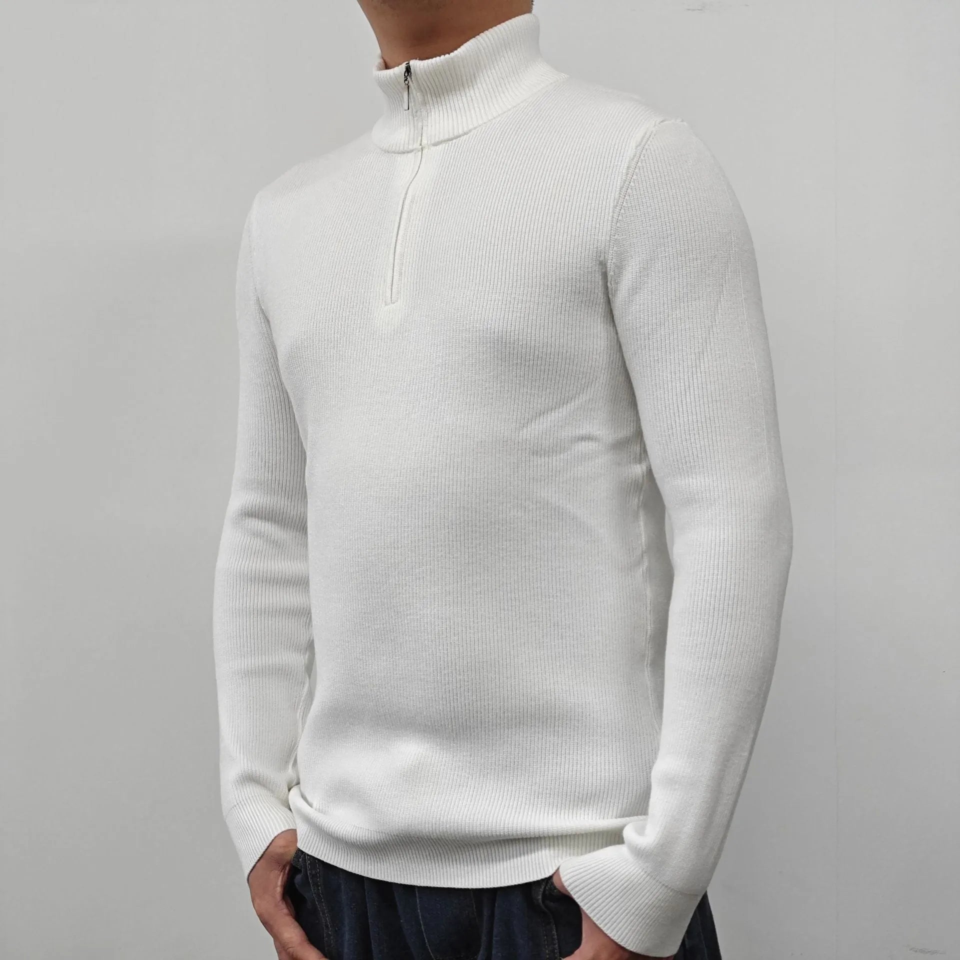 Man wearing a grey cotton blend half-turtleneck zip sweater with long sleeves