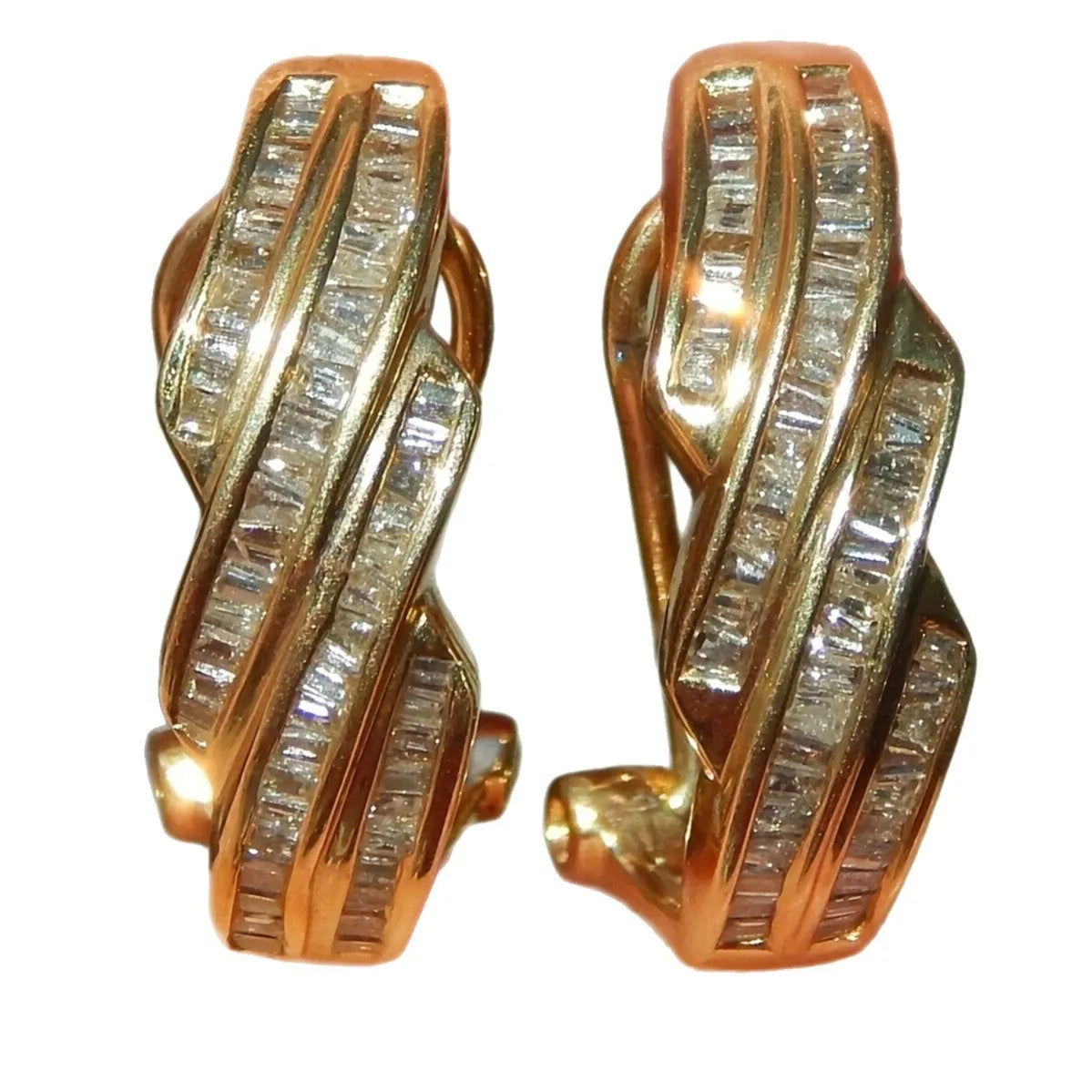 A pair of gold-coloured geometric earrings with round details, made from solid copper.