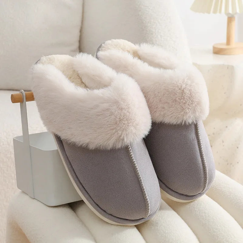 Brown women's plush indoor slippers with round toe, stitching detail, and flat non-slip sole.