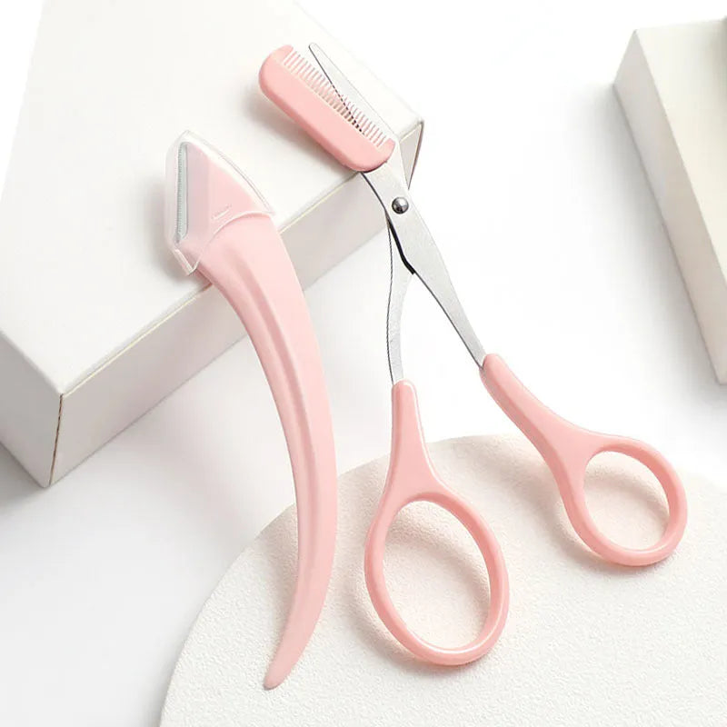 Close-up of a white and pink eyebrow trimming knife with a small comb attached on a plain background.