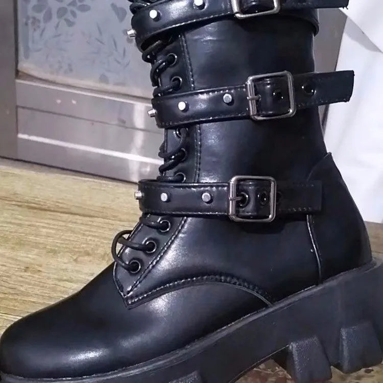 Women's black mid-calf knight boots with side zipper and metal belt buckle on artificial PU upper.