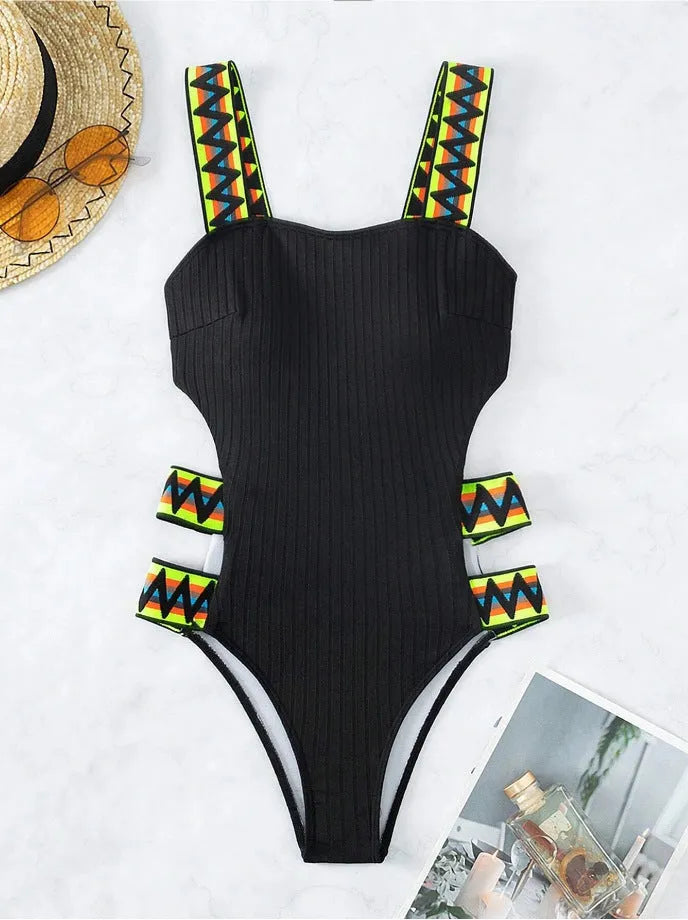 Women's solid colour one-piece polyester swimsuit shown in black and orange options