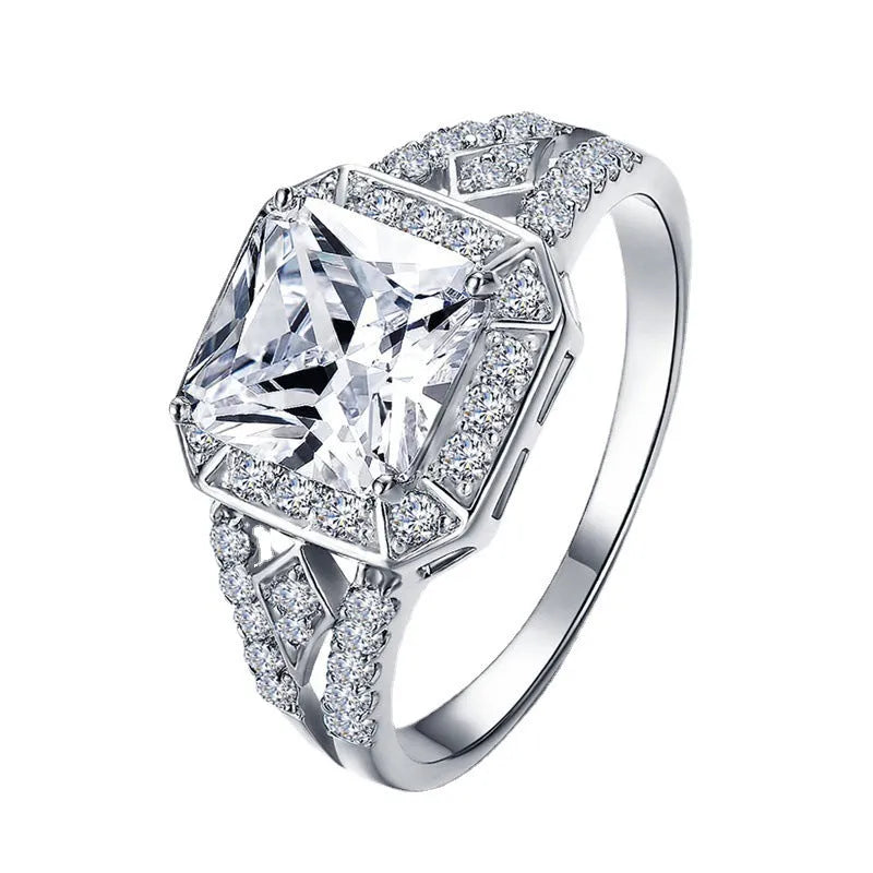 Geometric platinum colour zircon ring with quadrilateral design and hollow ornament construction