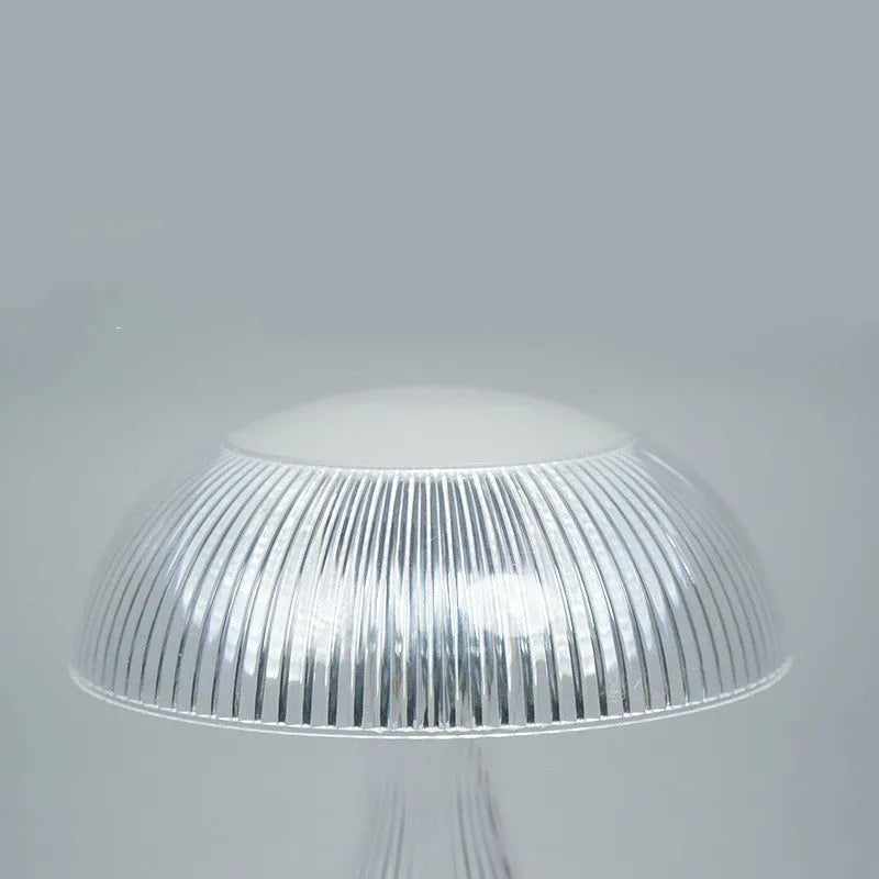White rechargeable three-colour changing LED table lamp with acrylic light body.