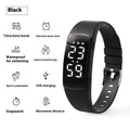 Vibration alarm clock watch with LED display on silicone strap showing multiple colour options