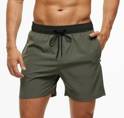 Men's blue drawstring shorts with a zippered pocket and stitching waist detail