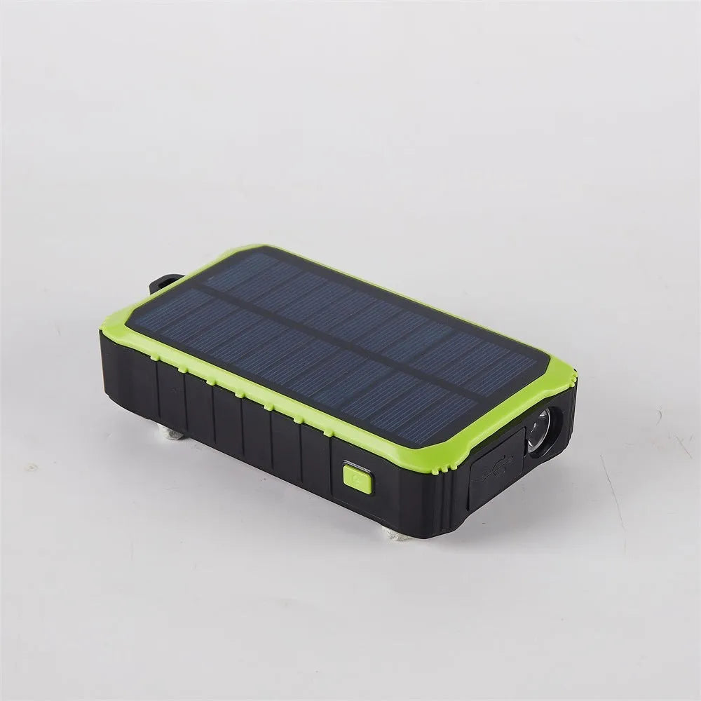 Orange and green hand solar power bank with solar panel, hand crank, dual USB ports, and LED light