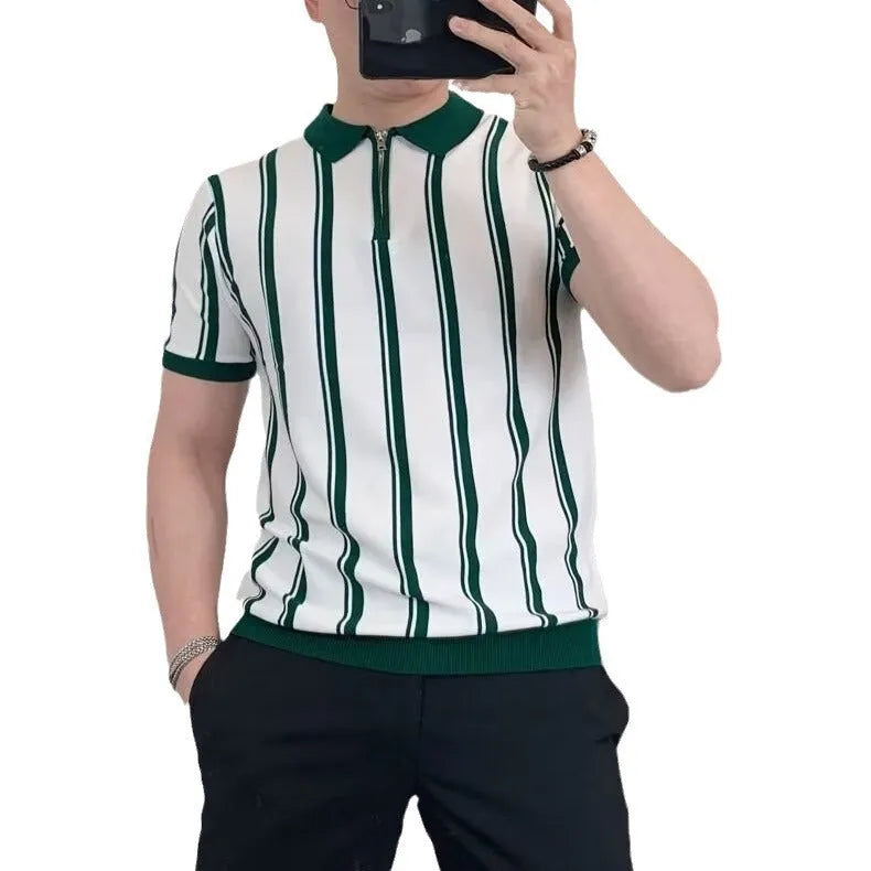 Man wearing a black and white vintage stripe T-shirt with a silver front zipper and cartoon graphic.