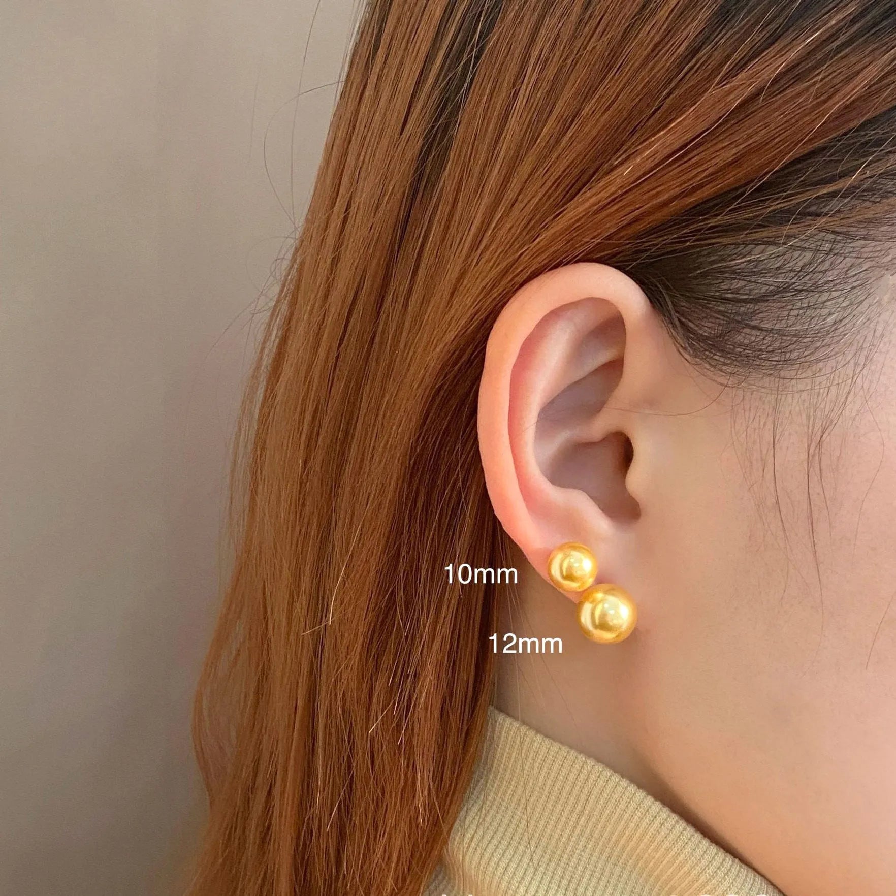 Geometric pearl stud earrings with an eight-point star setting, shown in silver.