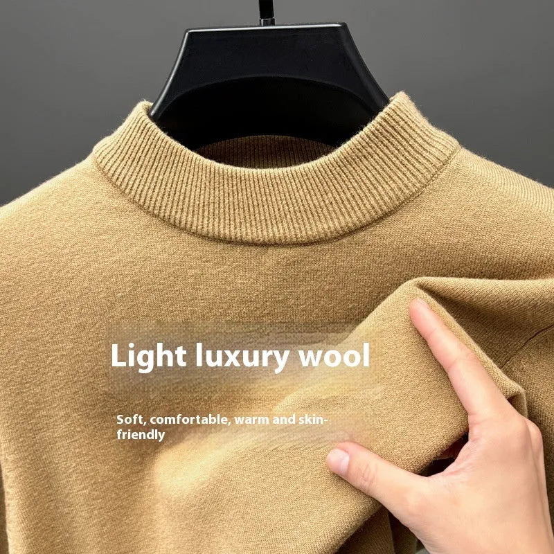 Men's solid colour fine yarn half-turtleneck long sleeve pullover on a hanger.