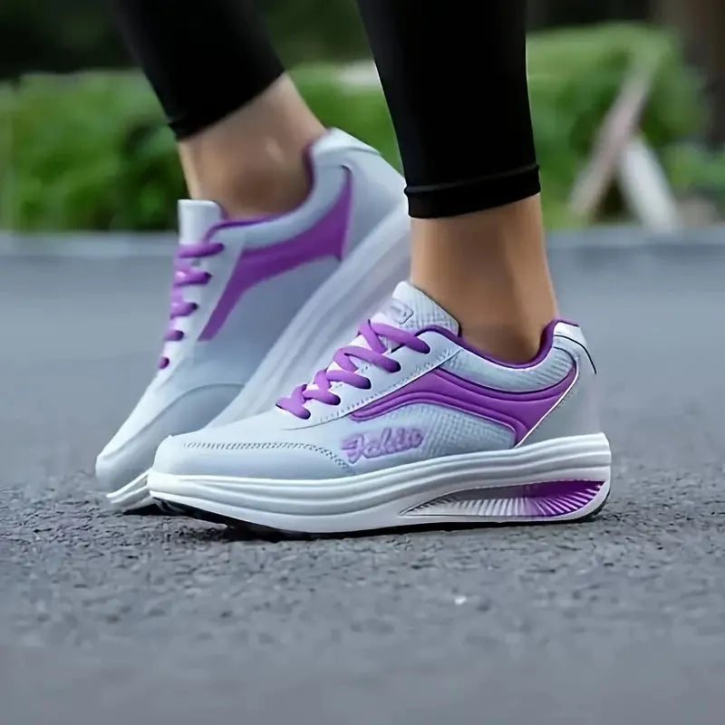 Women's grey powder travel sports shoes with a 3-5cm mid-heel on a neutral background.