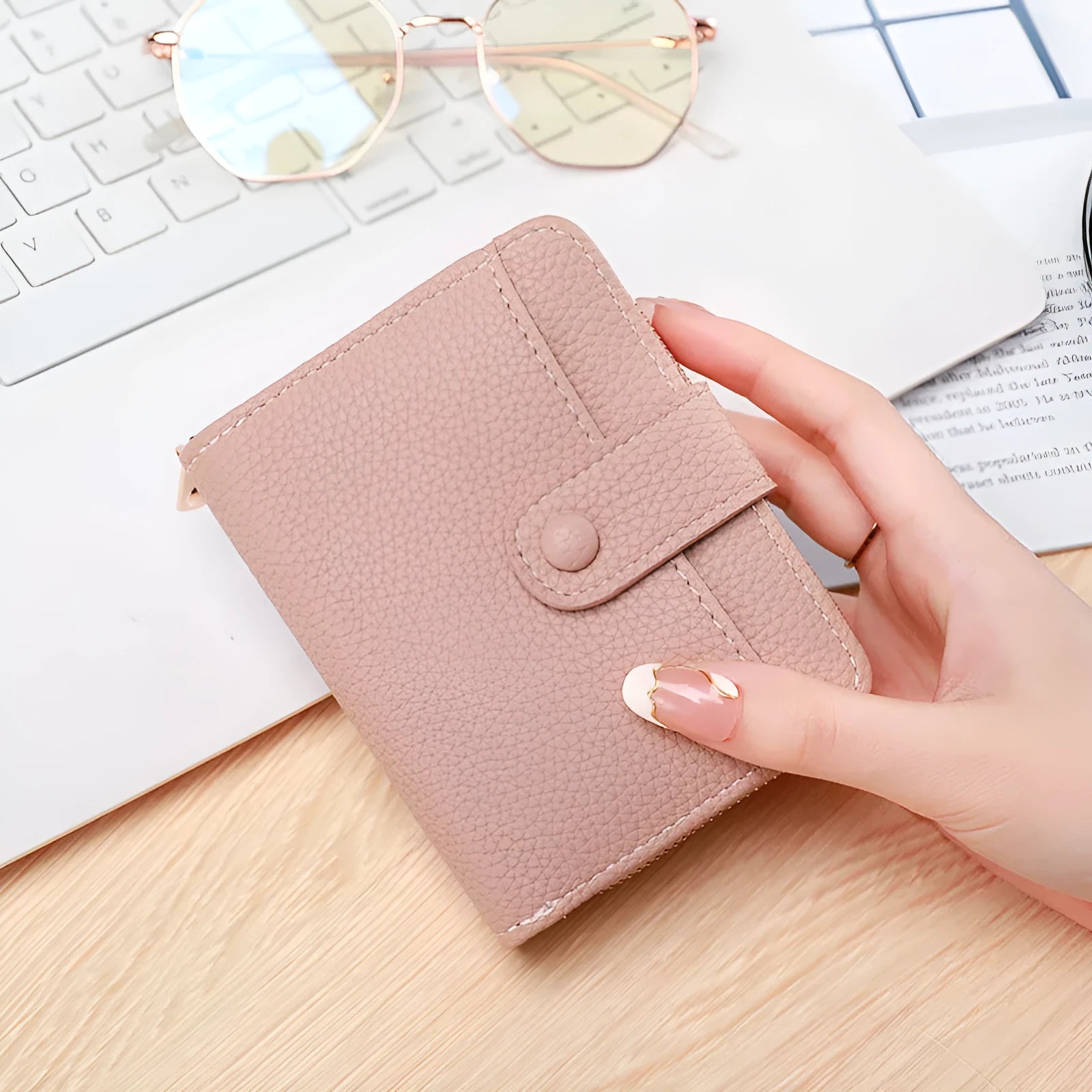 Ladies' short two-fold wallet in PU leather with a lychee pattern, shown in beige, pink, black, and red.