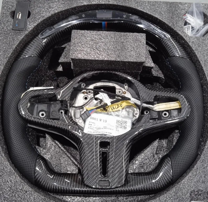 Black carbon fibre BMW steering wheel with LED controls and heating function
