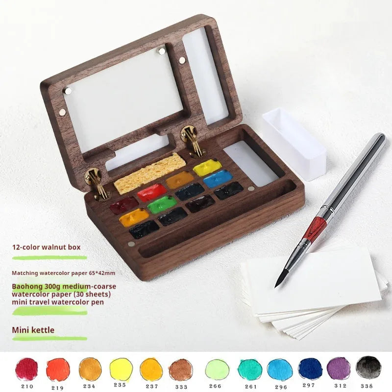 Mini wooden watercolour paint box with pigment suit inside, closed lid showing walnut-colour finish