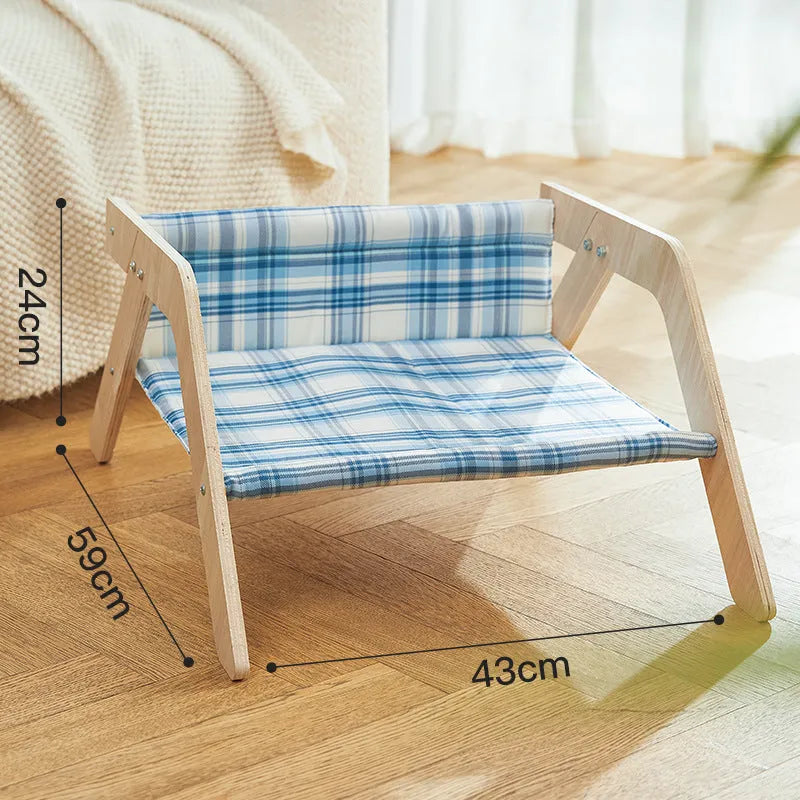 Green wooden elevated cat hammock bed for indoor lounging