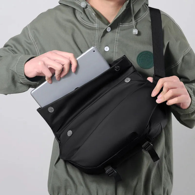 Grey PU crossbody bag with single adjustable shoulder strap showing interior phone pocket