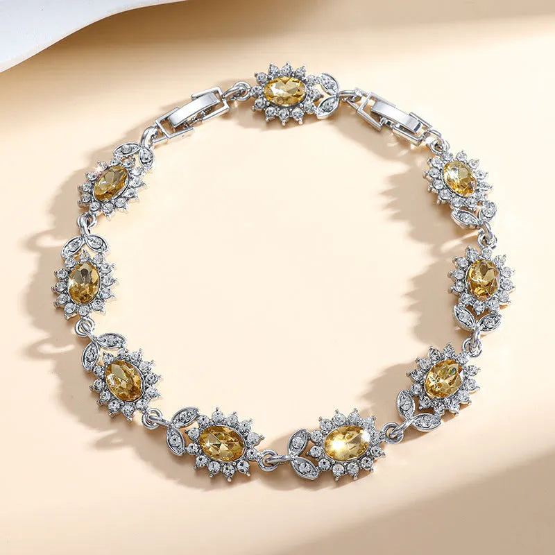 Women's bracelet with inlaid zircon gemstones in multiple colours on environmentally friendly alloy band